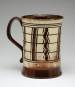 a tankard with a black and white striped design